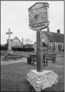 The War Memorial and Village Sign.